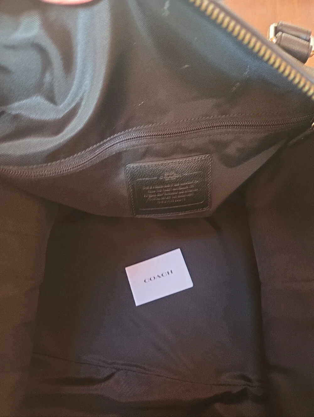 Coach Black Signature Leather Weekender tote bag dark gray and black.
